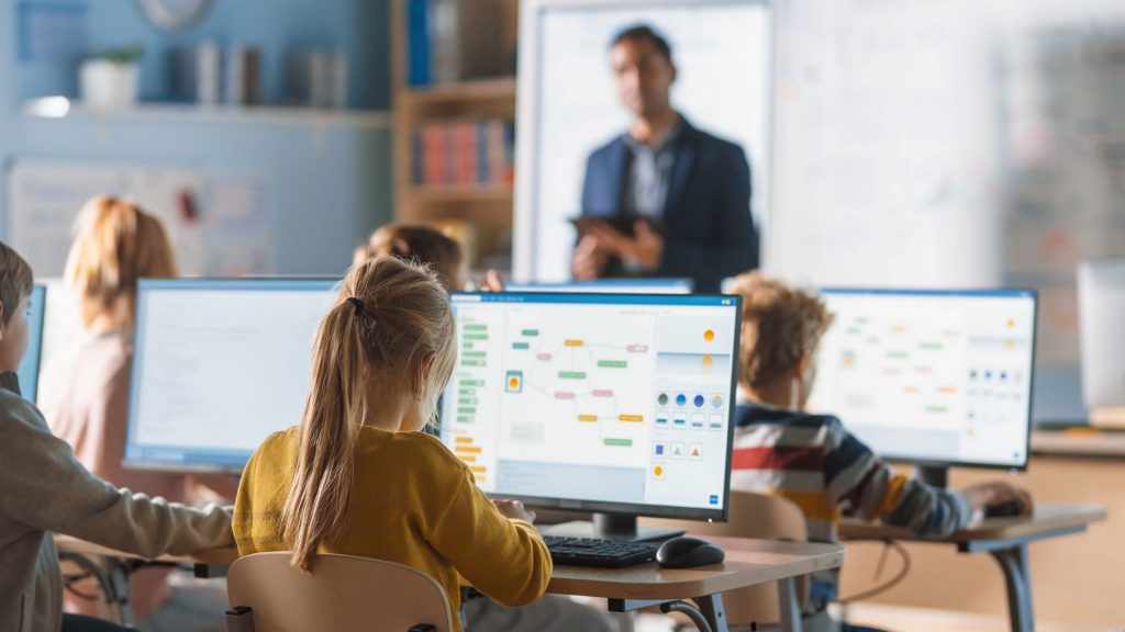 teacher teaching computer class
